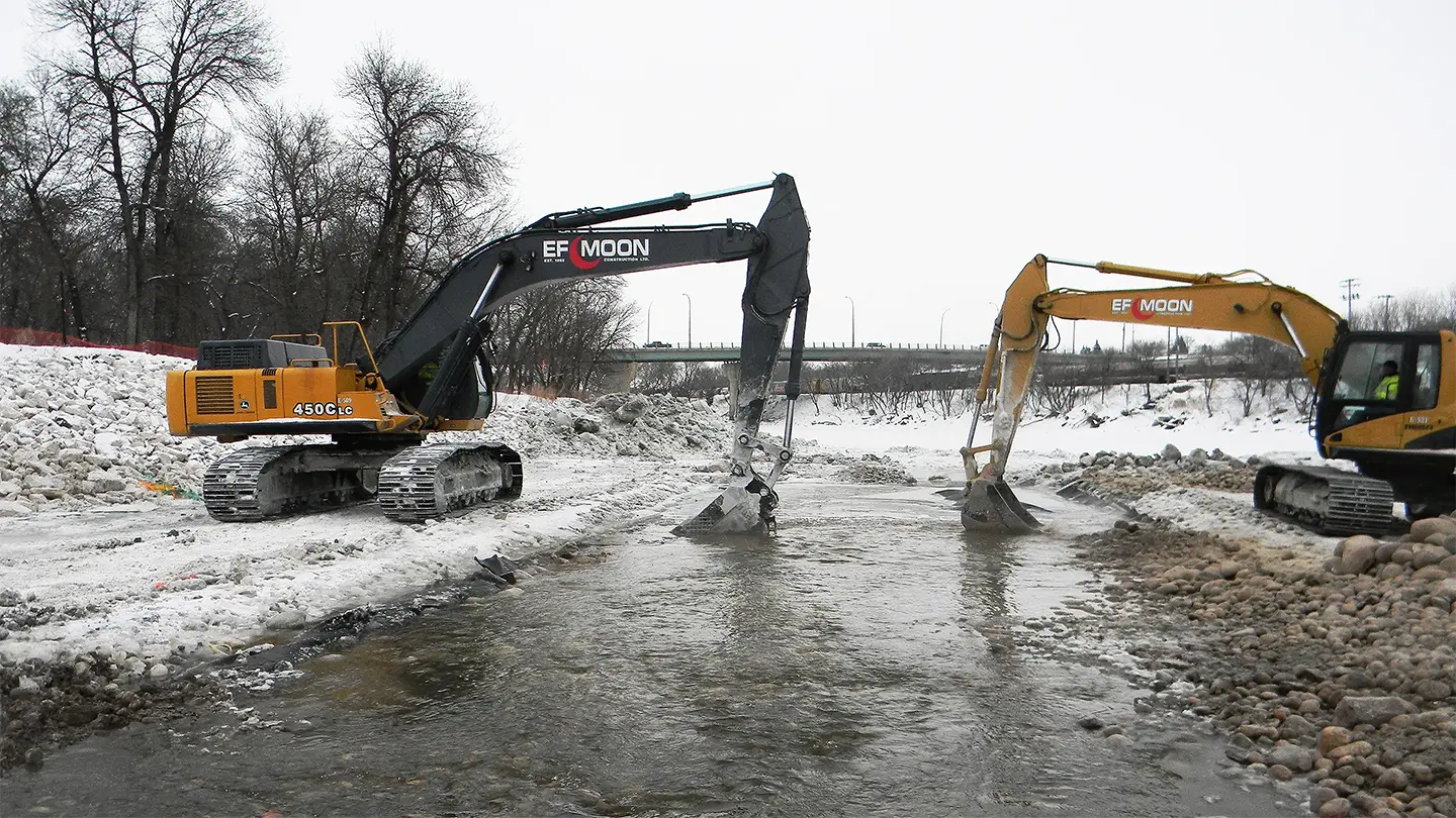 Excavators shaping the fishway channel