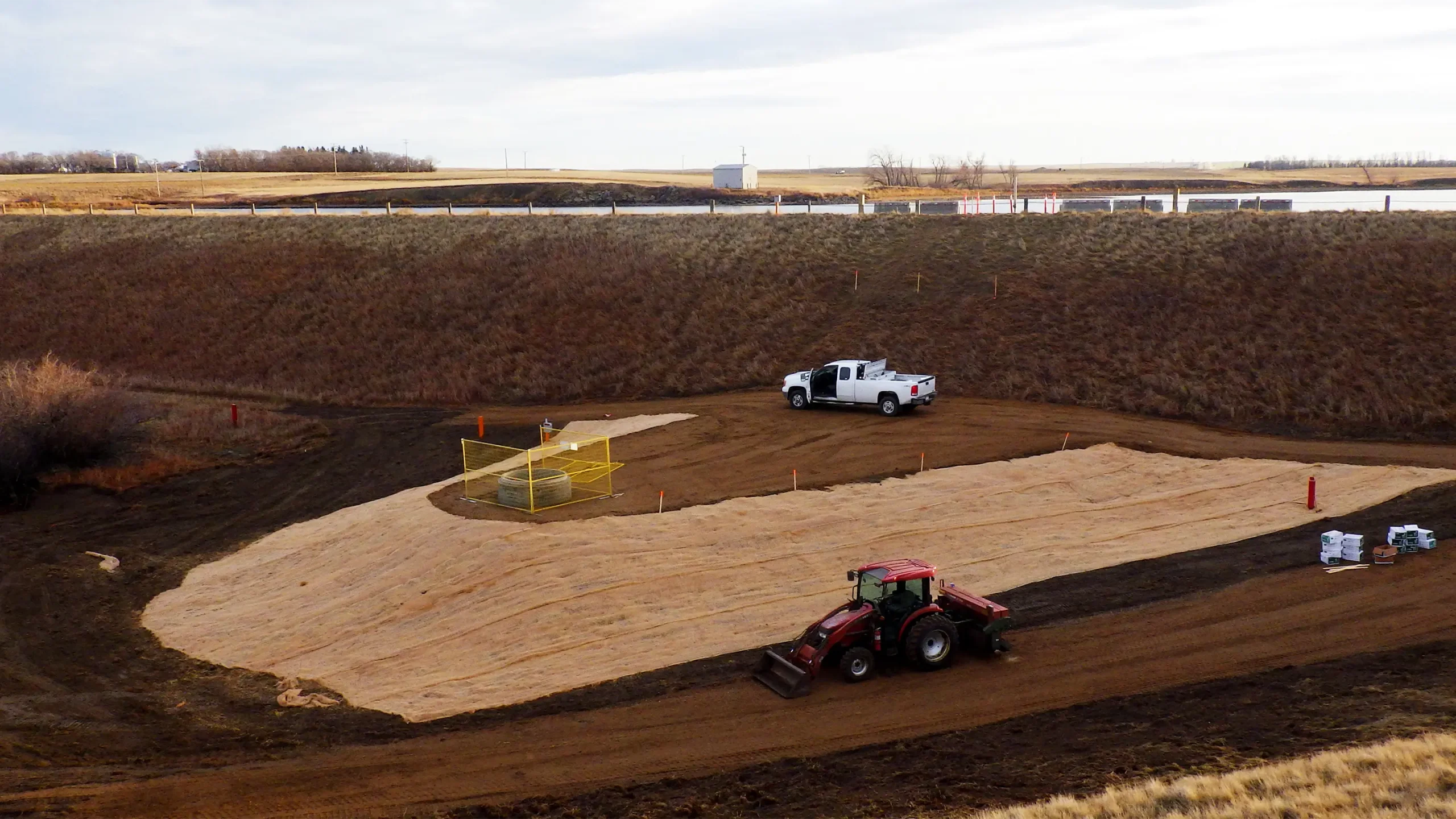 Toe berm constructed around access manhole