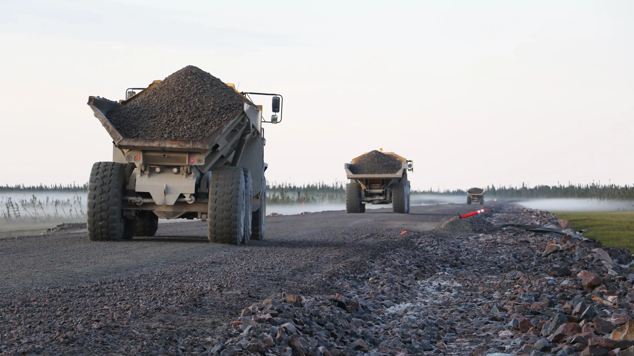 Trucks on site transporting fill