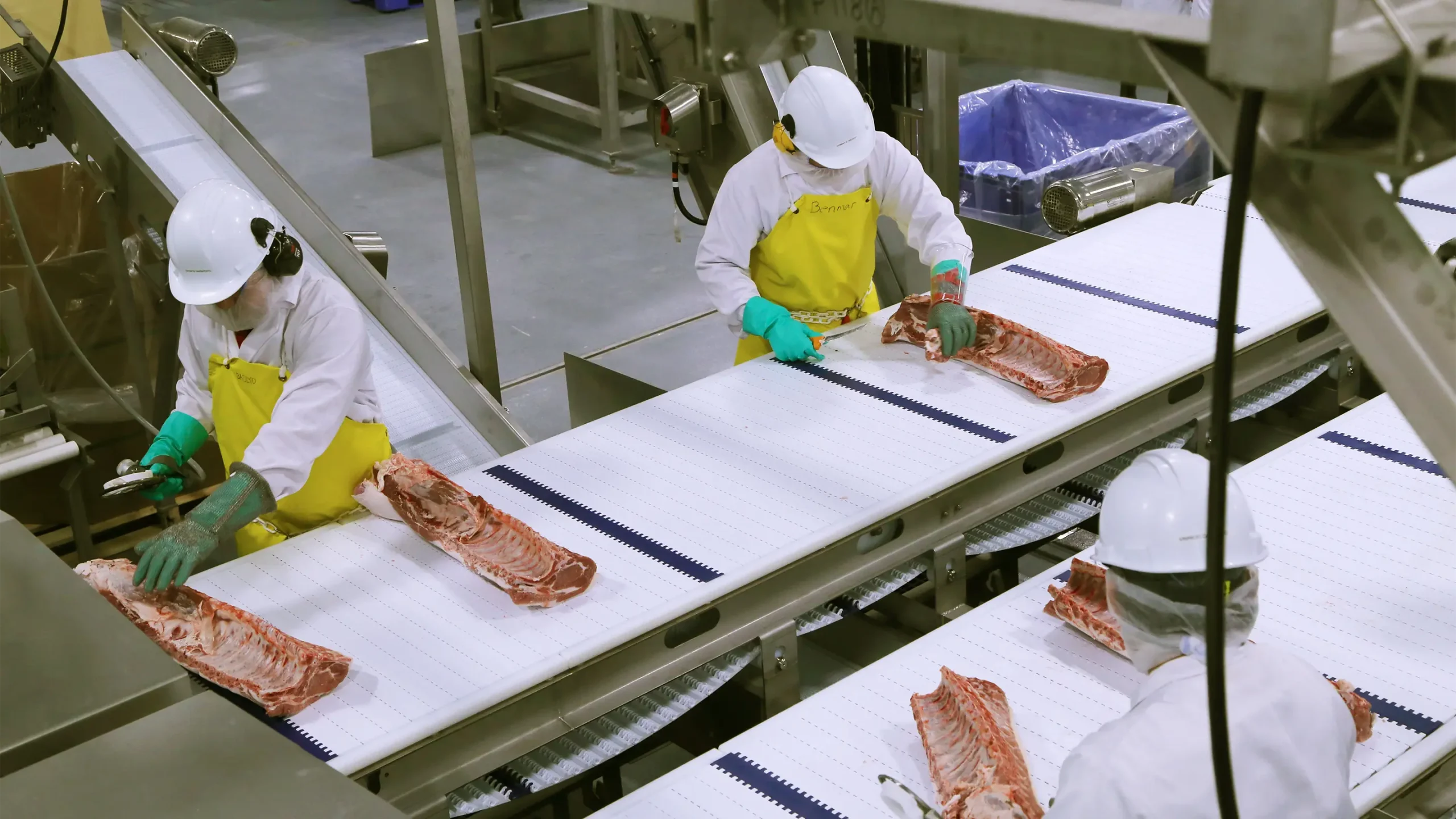 Pork being processed by workers