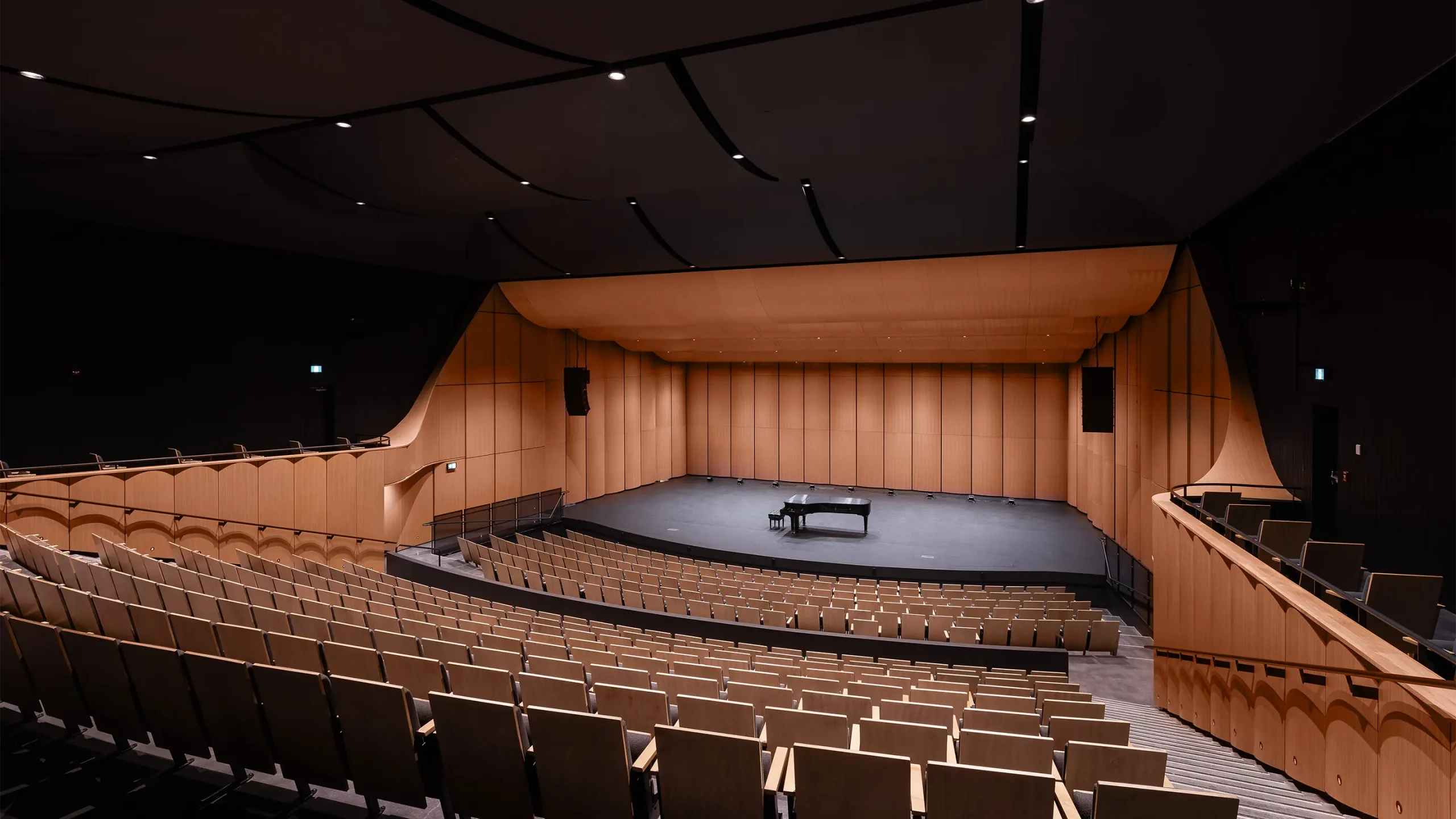 Concert hall with grand piano on stage