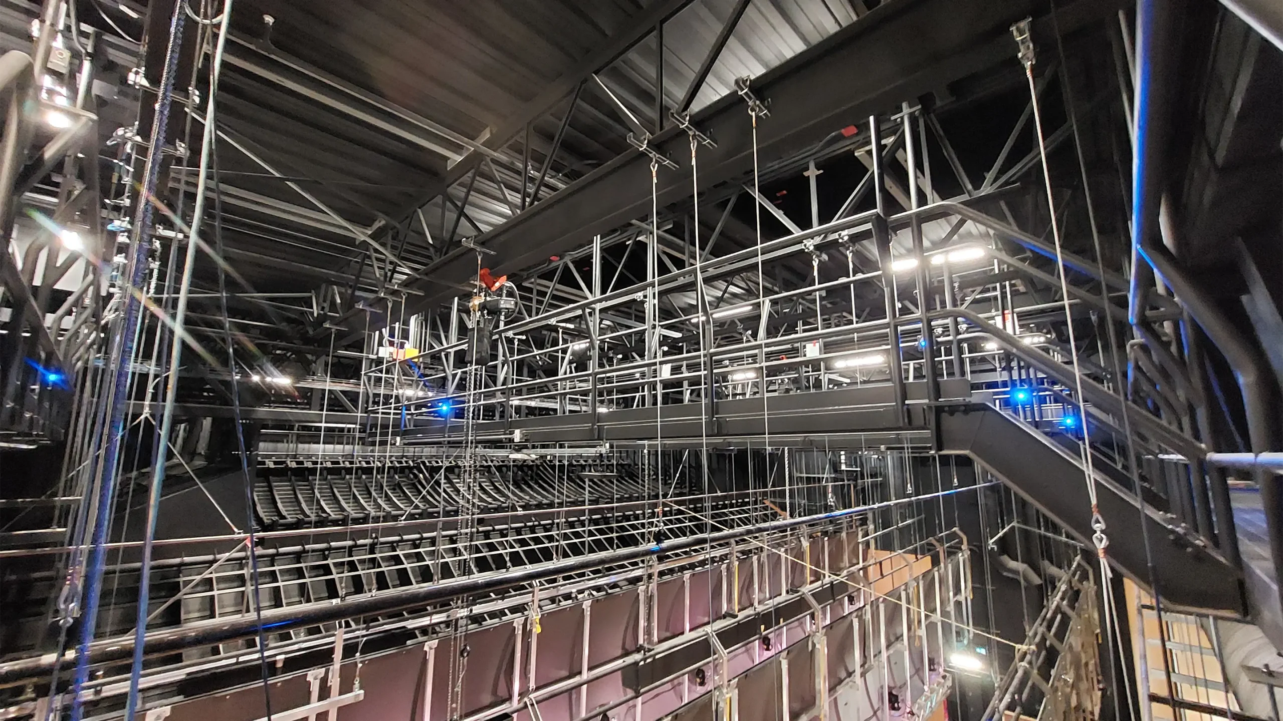 Structural joists integrated into the design elements over the stage