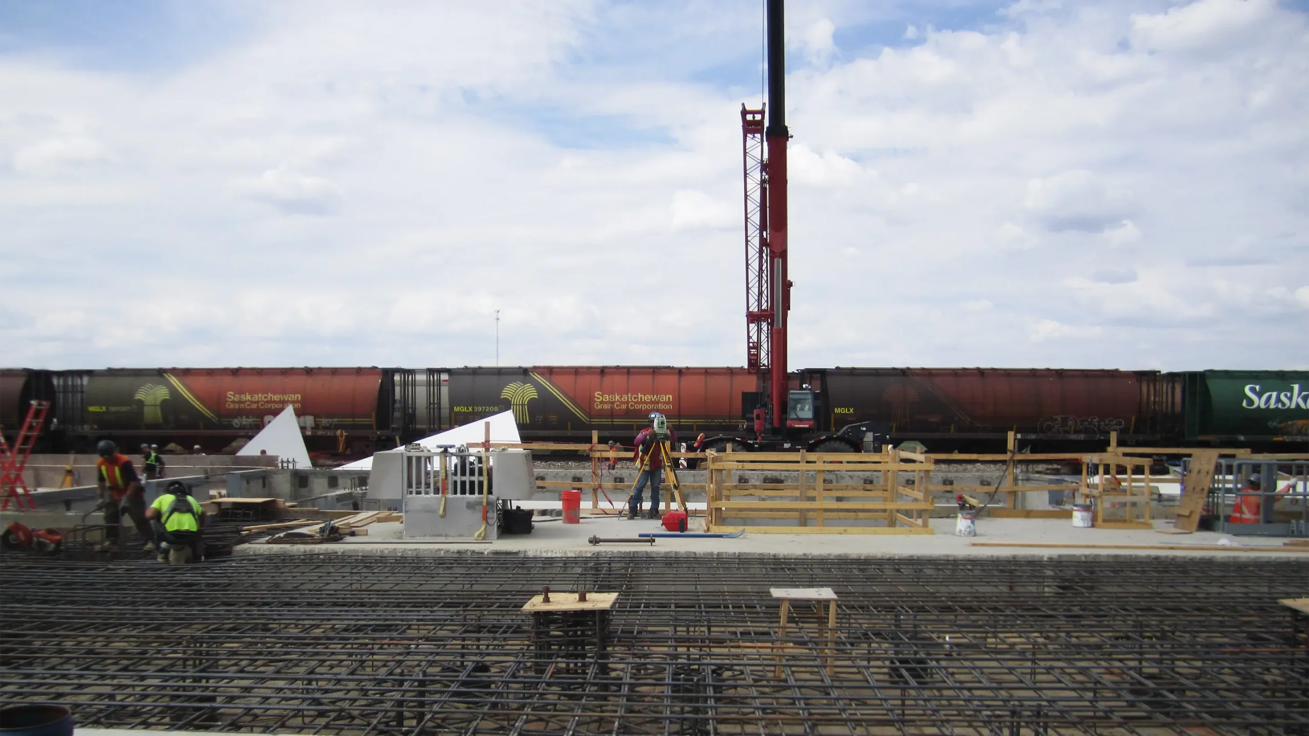 Construction of foundation with train in background