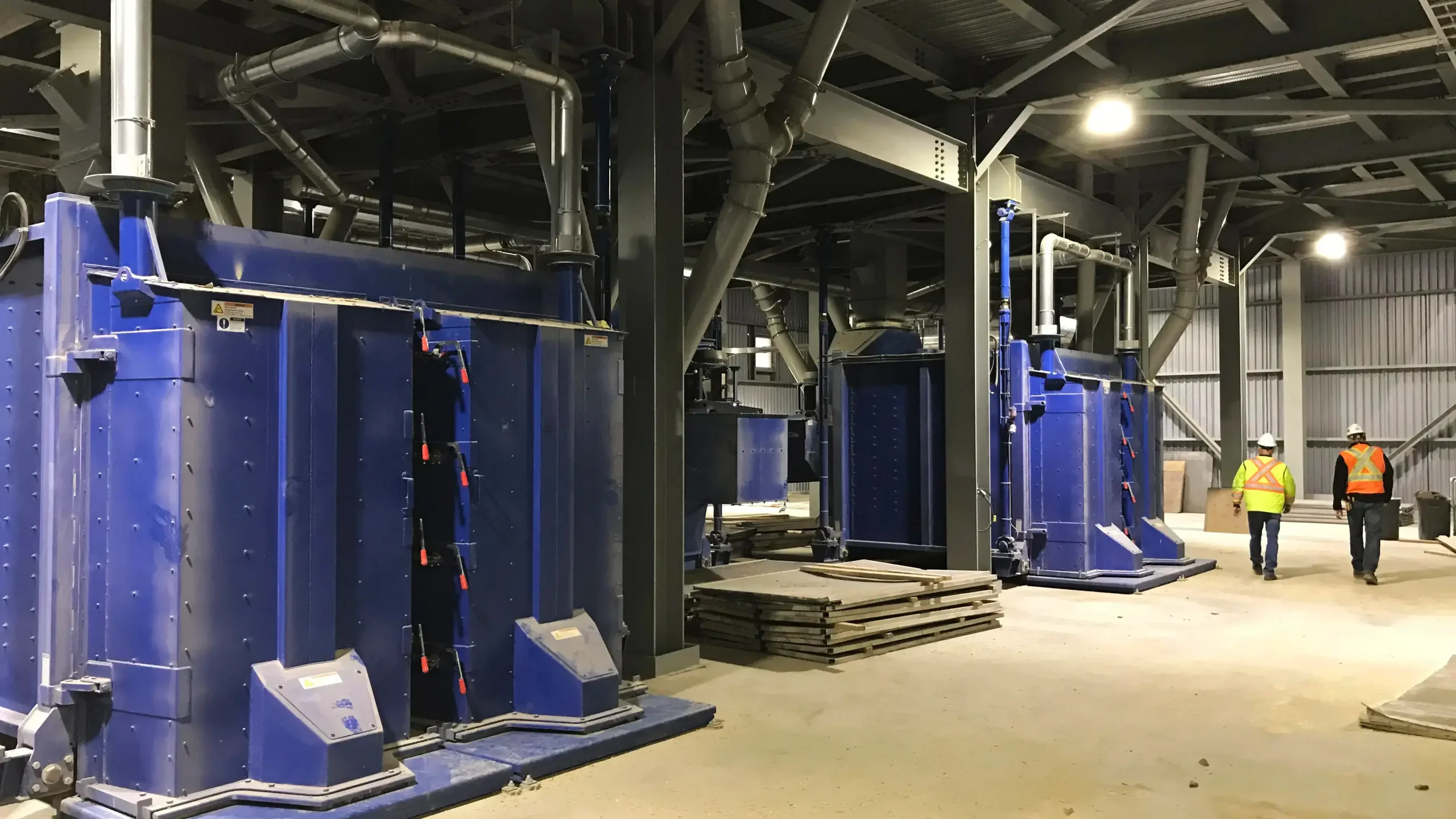 Blue seed cleaning machinery inside facility