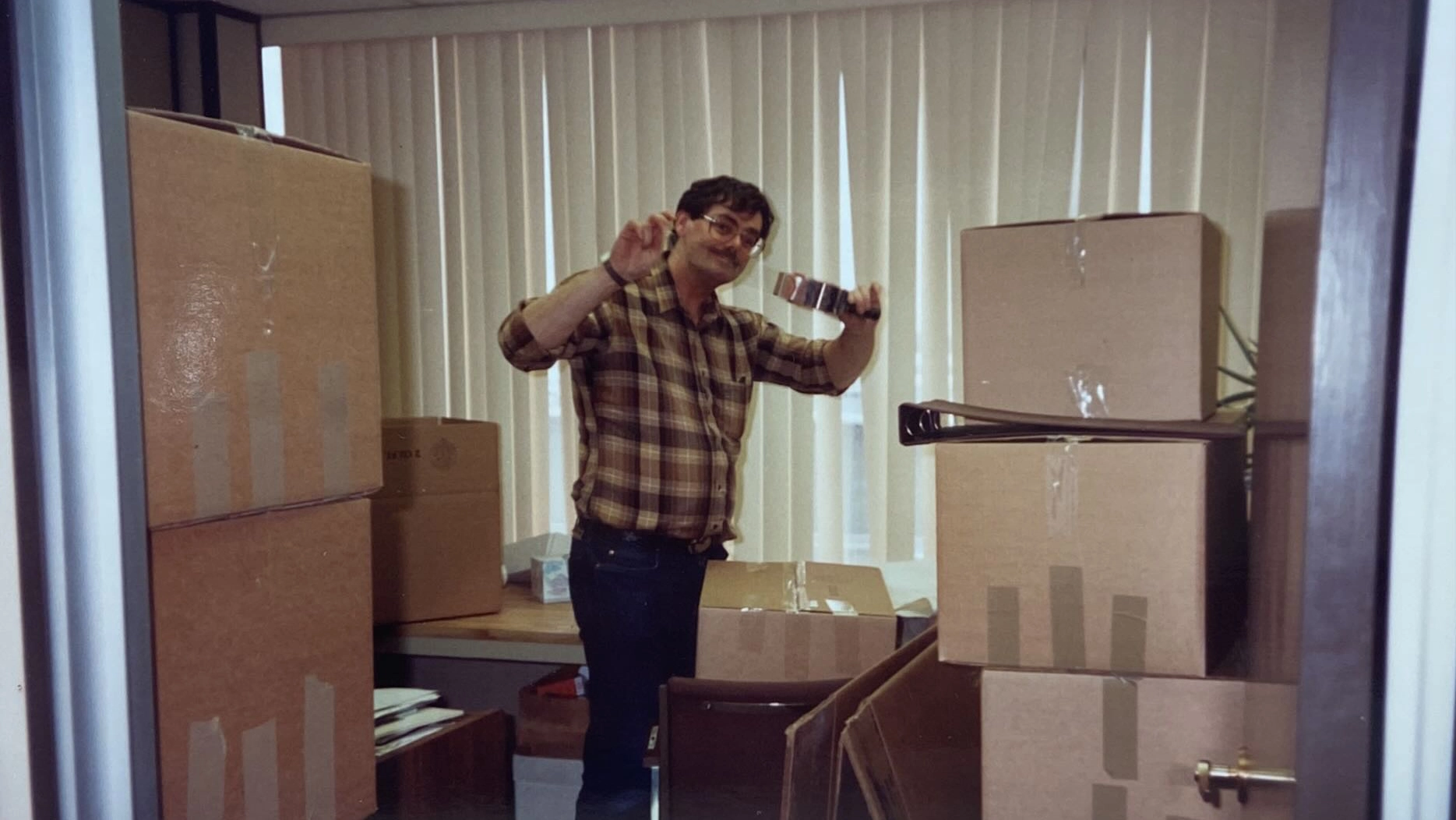 Bert a founder unpacking boxes in a our Willson Place office