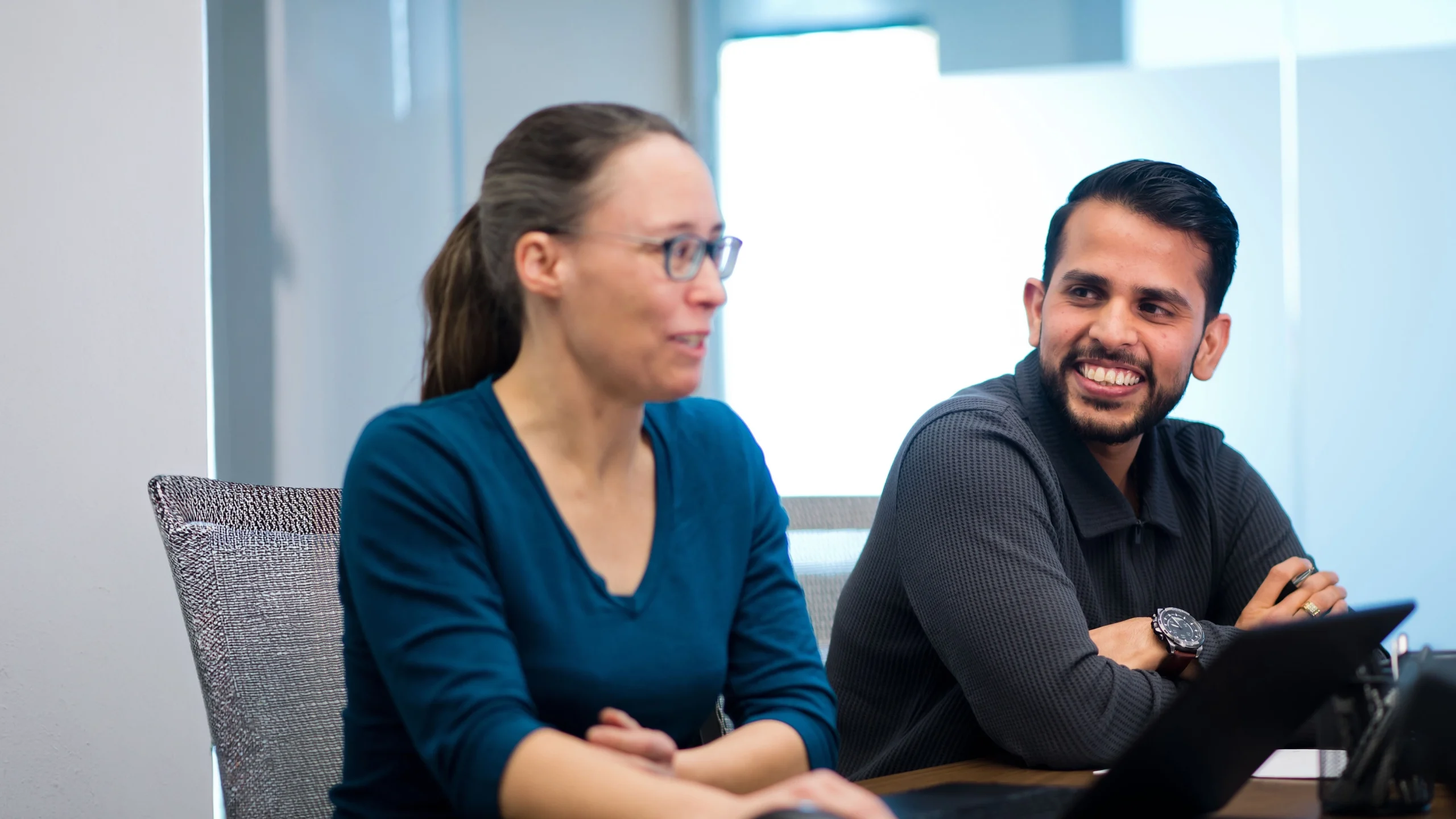 Two people discussing a project