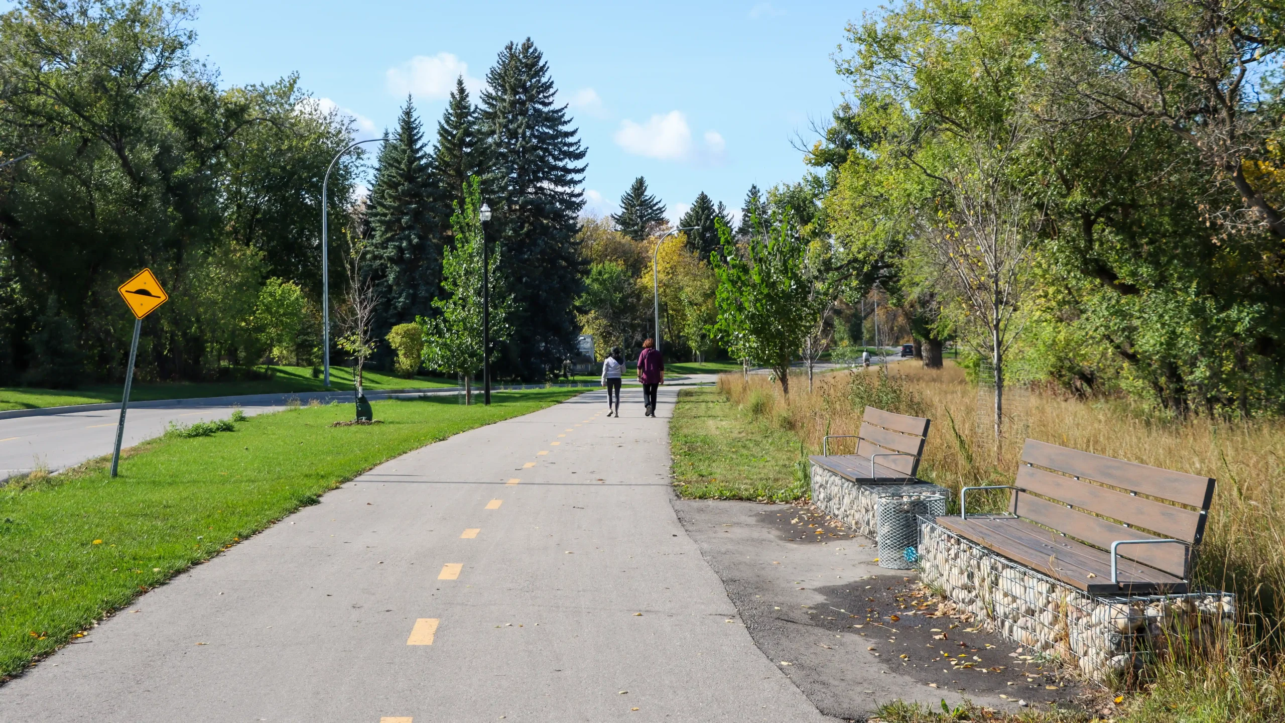 Two people walking on the new pathway