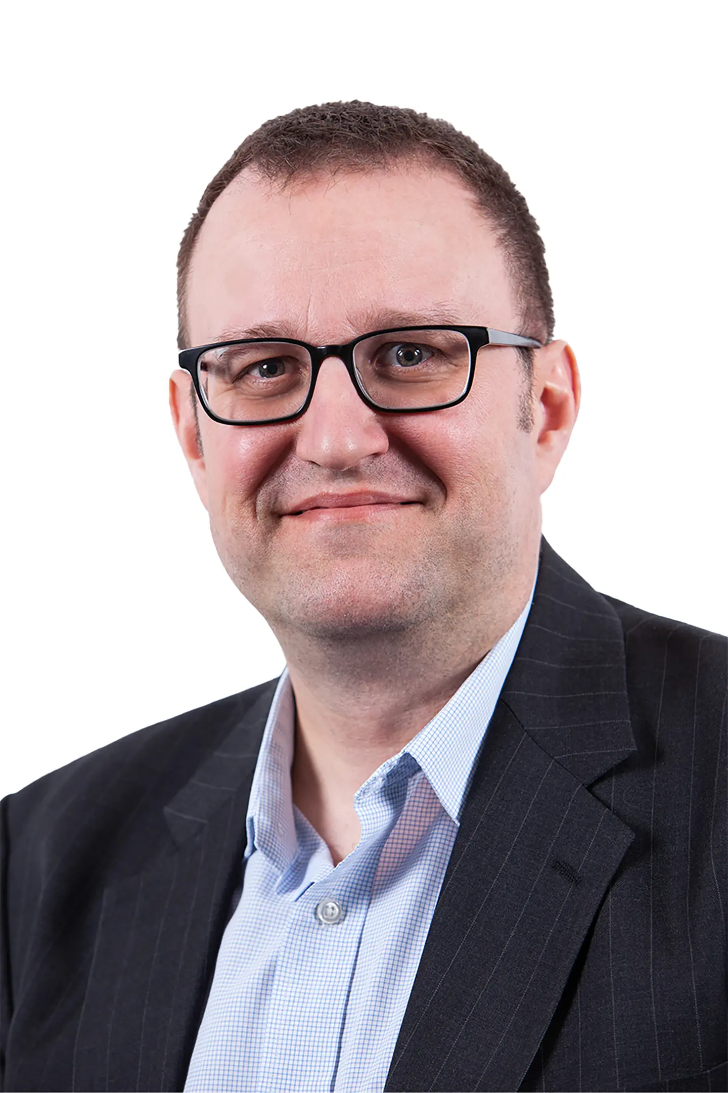 Professional headshot of a person smiling at the camera against a white background.