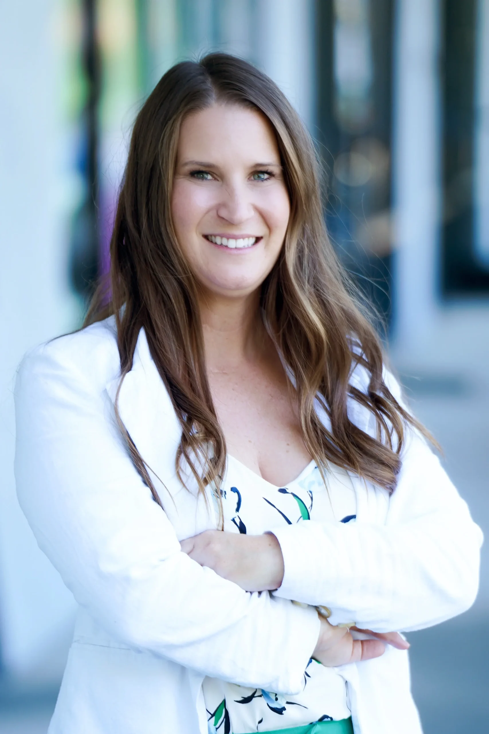 Portrait of Amy Deakyne smiling, arms folded.