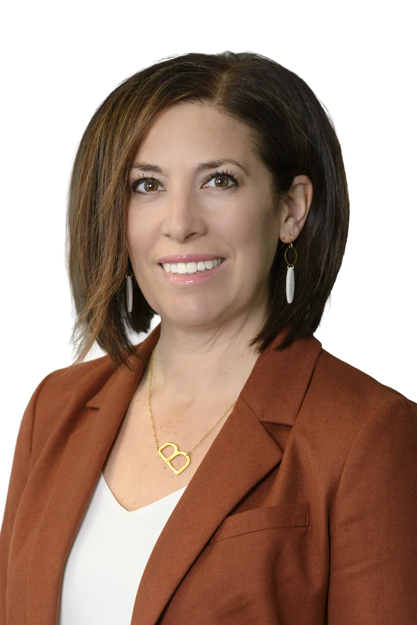 Professional headshot of a person smiling at the camera against a white background.