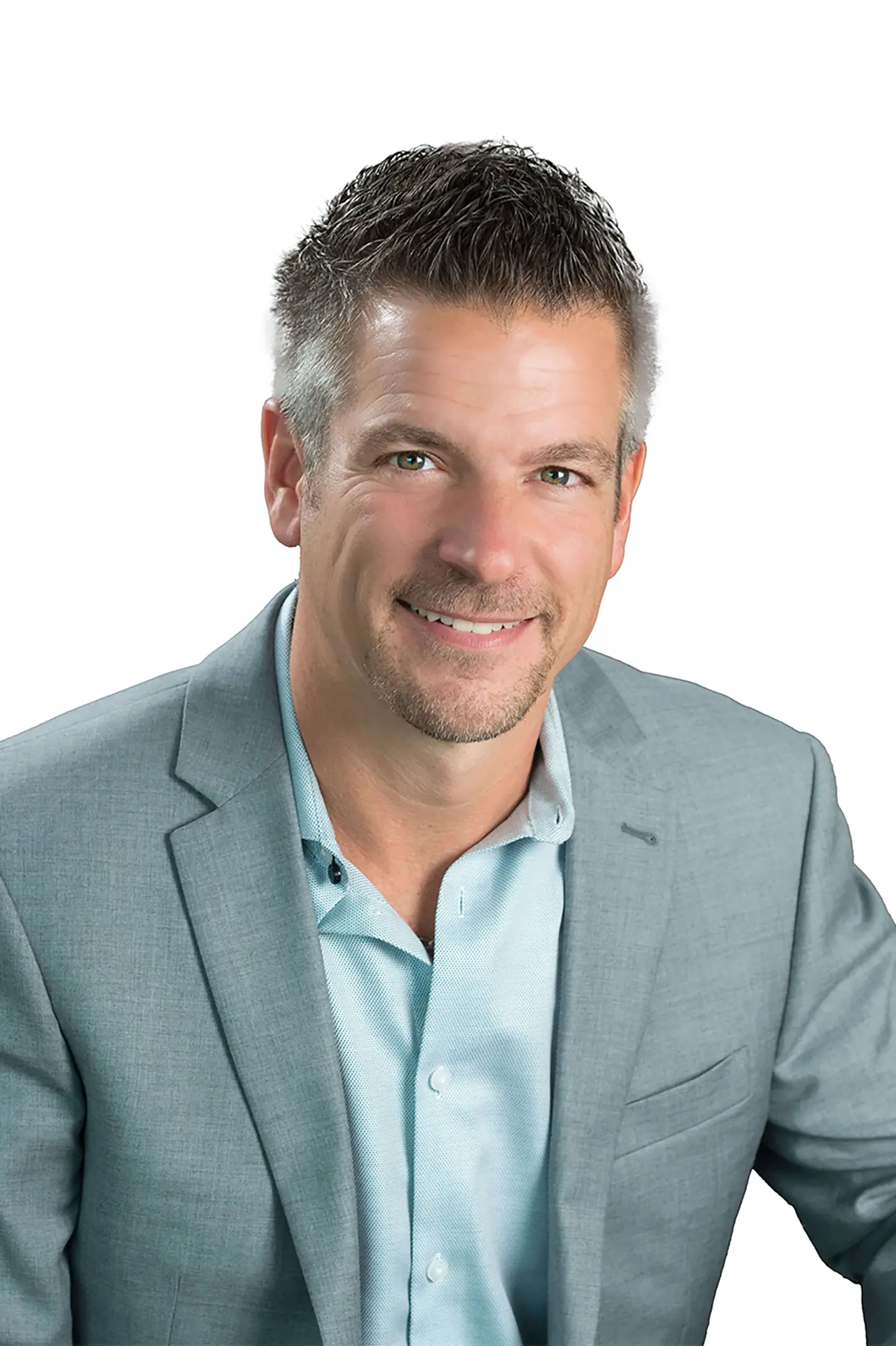 Professional headshot of a person smiling at the camera against a white background.