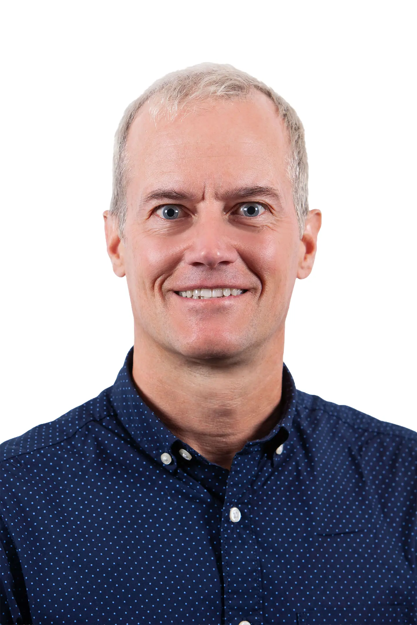 Professional headshot of a person smiling at the camera against a white background.