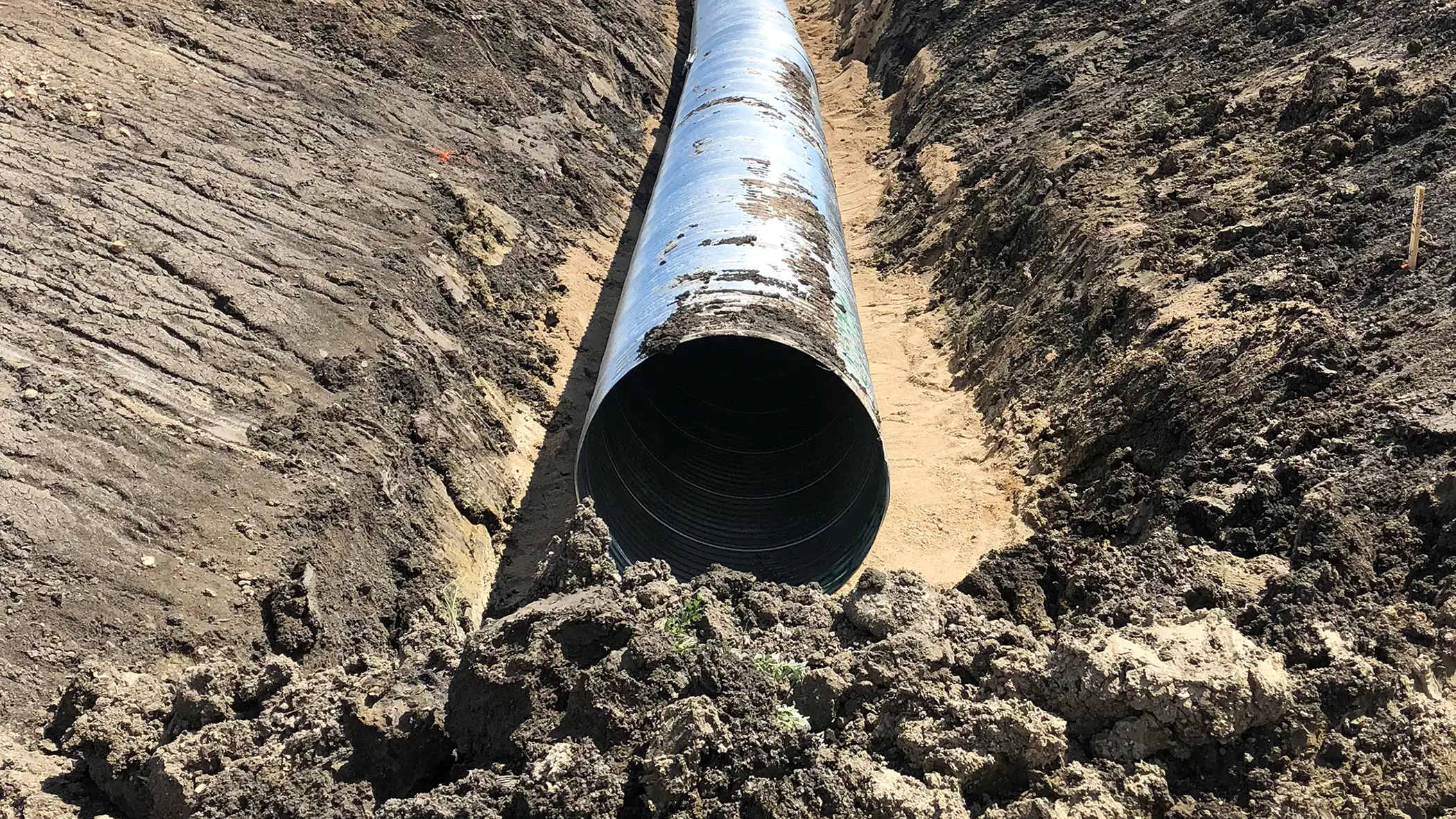 Drainage pipe alongside Charette Road