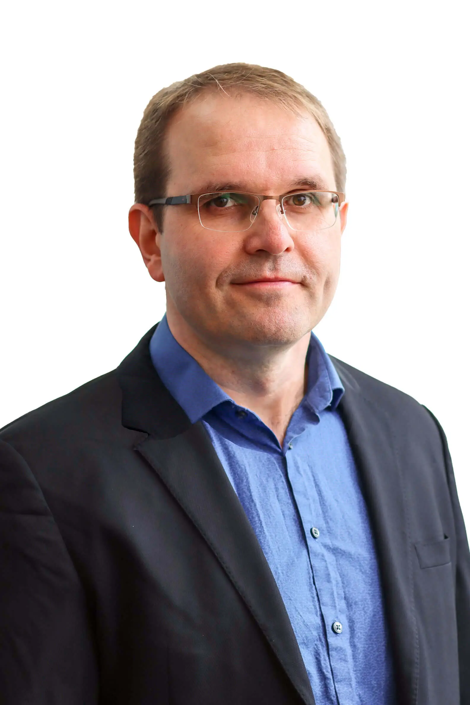 Professional headshot of a person smiling at the camera against a white background.