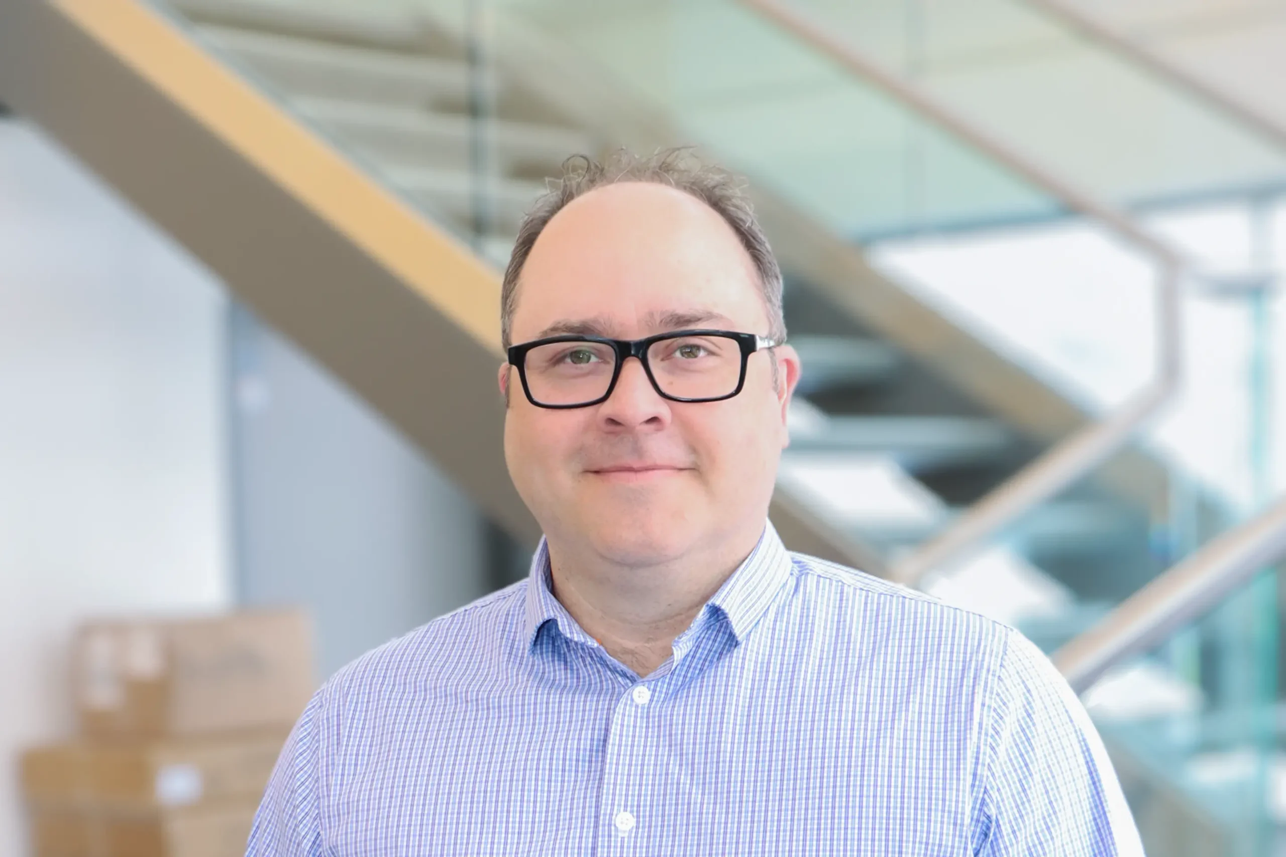 Michael Turko standing in front of stairs
