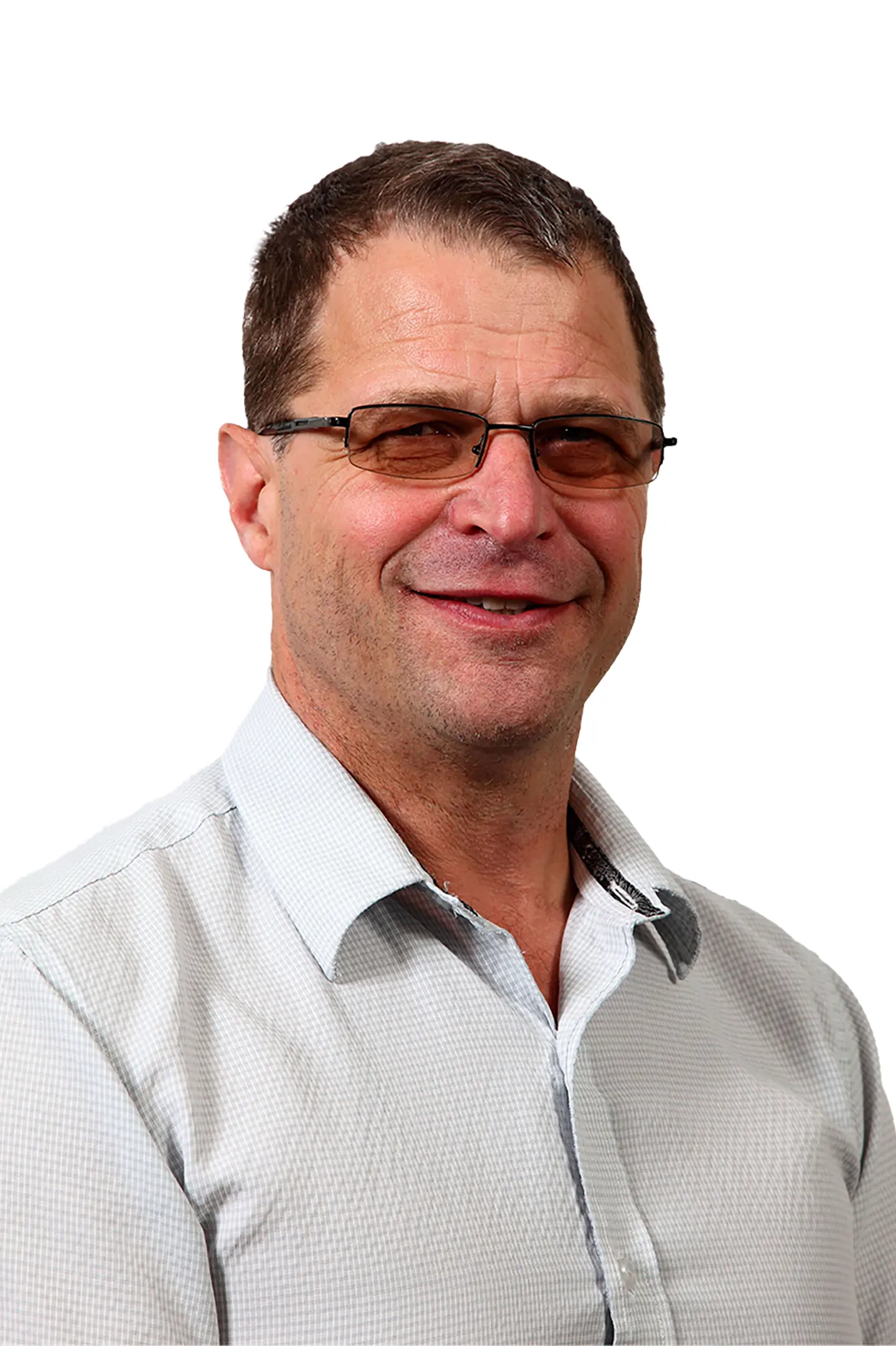 Professional headshot of a person smiling at the camera against a white background.
